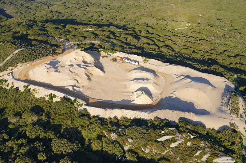 Aerial view of the pit and haul road in coastal bush